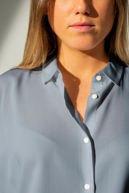 Free photo woman wearing blue shirt close up studio shoot