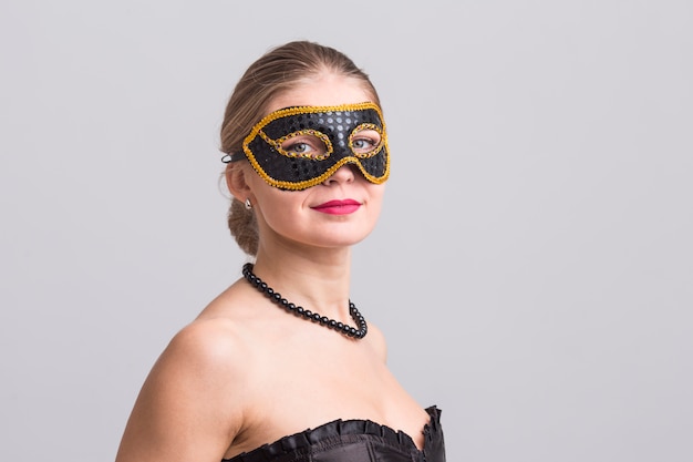 Woman wearing carnival mask