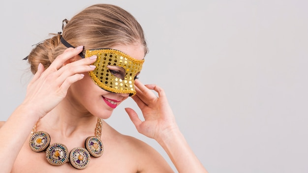 Woman wearing carnival mask