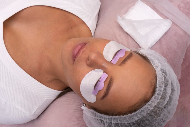 Woman wearing eye patches top view