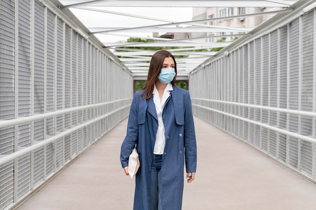 Free photo woman wearing face mask medium shot