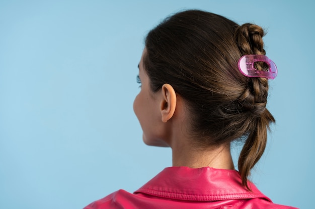 Free photo woman wearing hair clip  back view