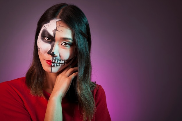 Woman wearing halloween mask