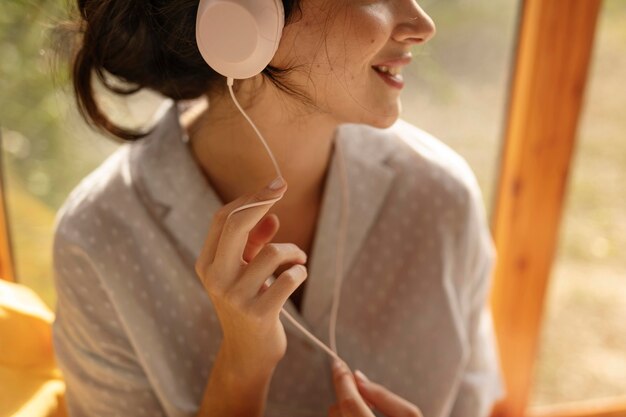 Woman wearing headphones close up