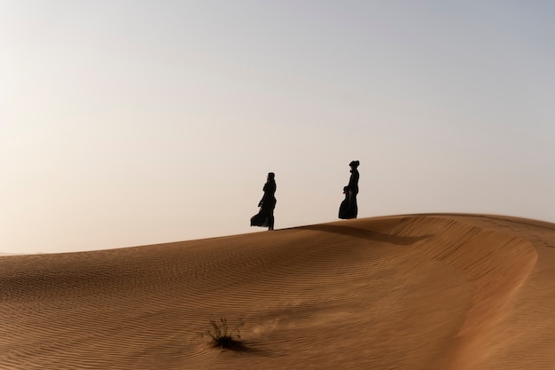 Woman wearing hijab in the desert