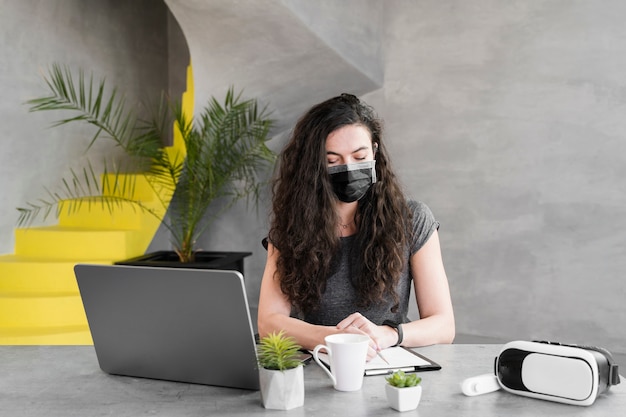 Woman wearing medical mask indoors