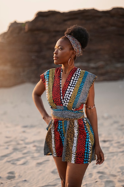 Woman wearing native african clothing at the beach