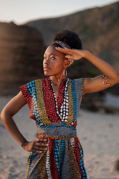 Woman wearing native african clothing at the beach