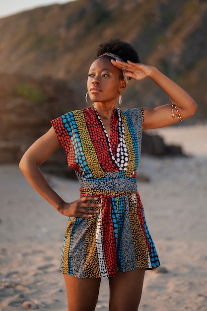 Woman wearing native african clothing at the beach