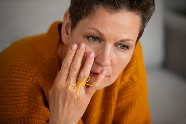 Free Photo woman wearing a string on finger for reminder