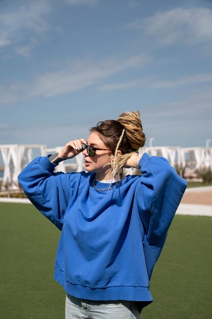 Woman wearing sunglasses side view