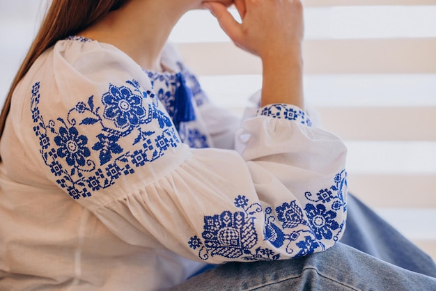 Free photo woman wearing traditional ukrainian vyshyvanka