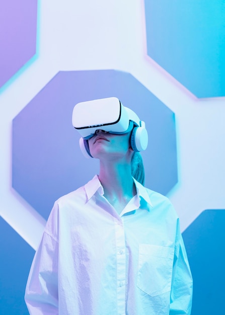 Free Photo woman wearing virtual reality simulator