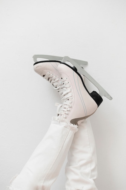 Free Photo woman wearing white ice skates