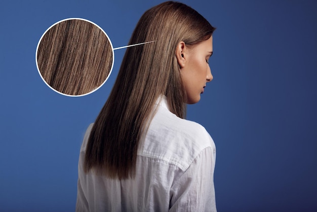 Woman wears white shirt from backside showing ideal straight hair