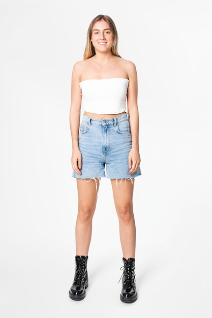 Woman in white bandeau top and denim skirt casual fashion full body