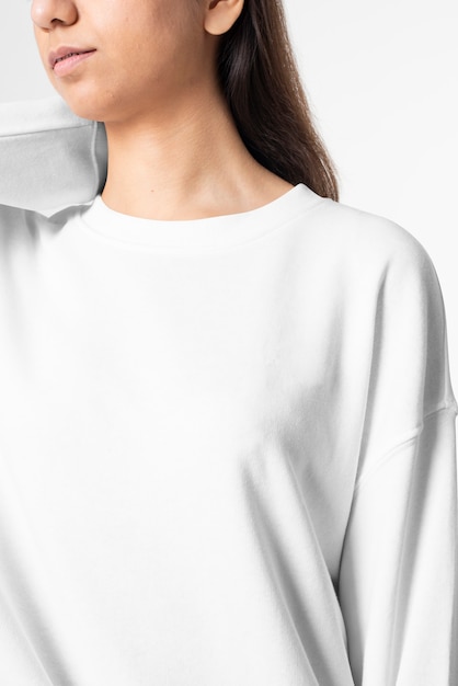 Woman in white long sleeve tee men's fashion studio portrait