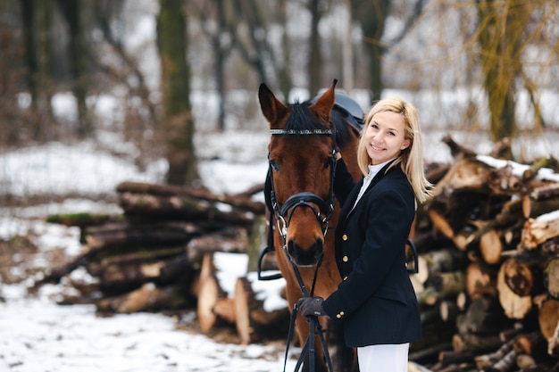 Free photo woman in winter with horse