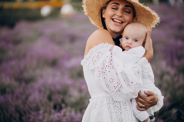 Woman with baby son in a lavander field