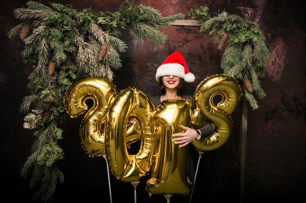 Free photo woman with balloons on new year