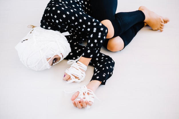 Free photo woman with bandaged face and hands lying