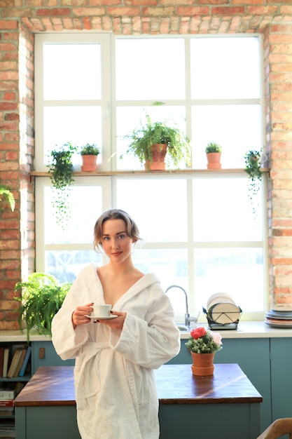 Free photo woman with bathrobe