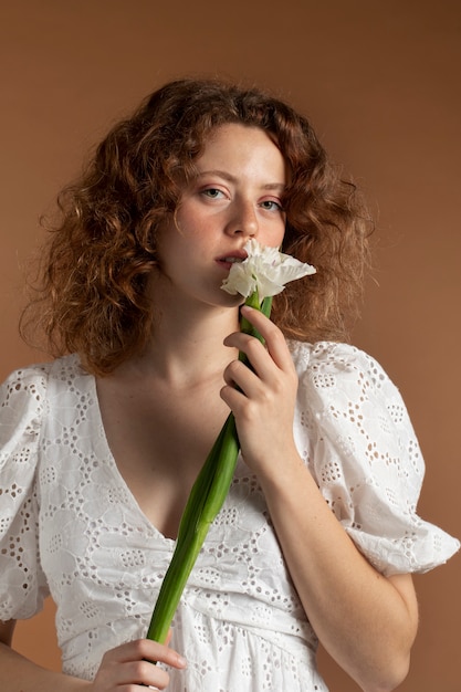 Woman with beautiful gladiolus flowers