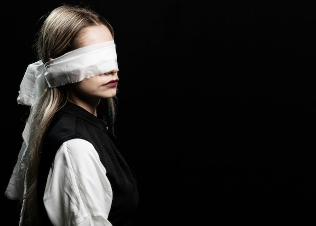 Free photo woman with blindfold and copy space