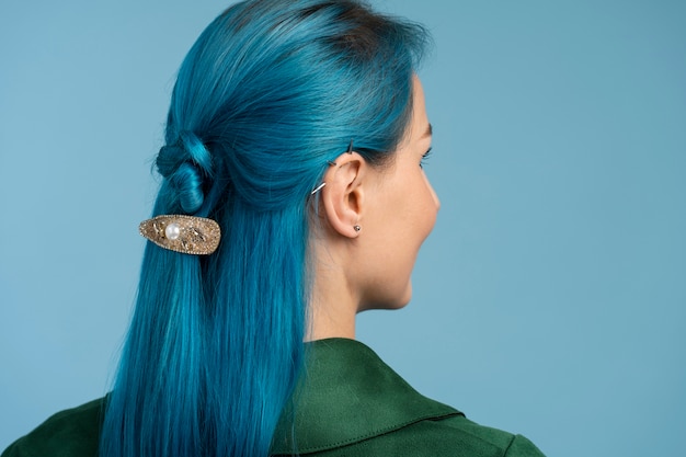 Free photo woman with blue hair side view