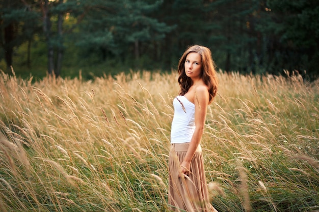 Free Photo woman with brown skirt spending the day in the field