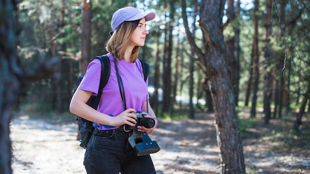 Woman with camera and cap