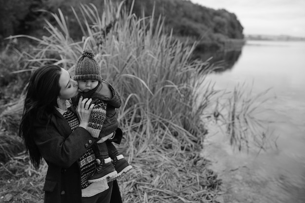 Woman with child at pond