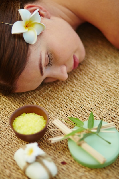 Woman with closed eyes in spa salon