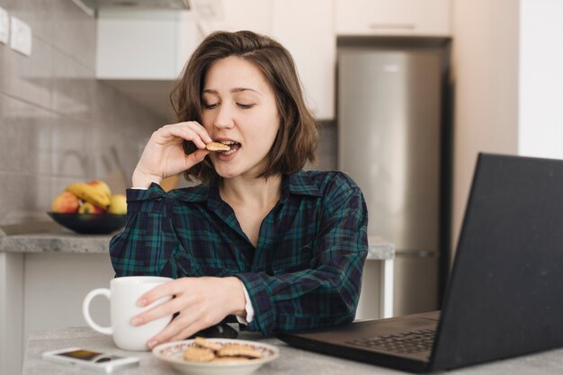 Woman with coffee cup at home