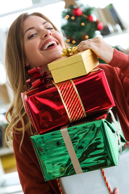 Woman with colorful gifts in hands