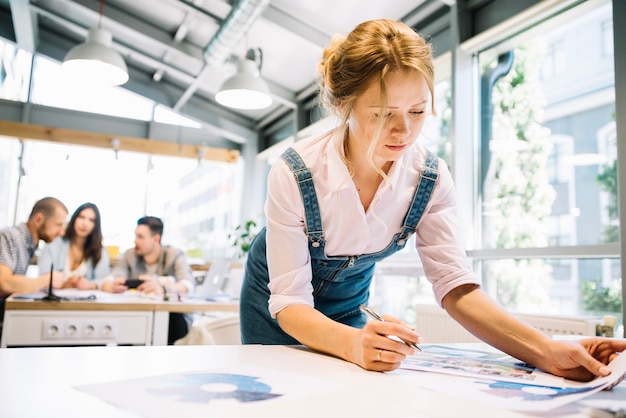 Woman with diagrams in modern office