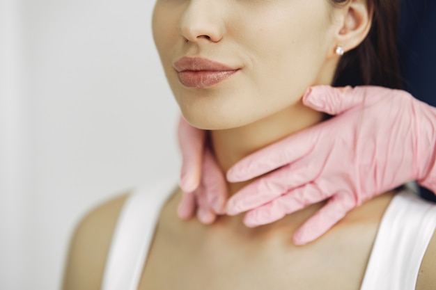 Free photo woman with a doctor in cosmetology studio