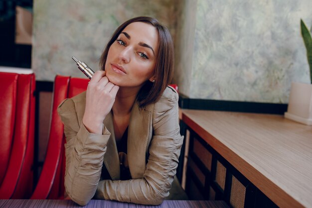 Woman with a electronic cigarette