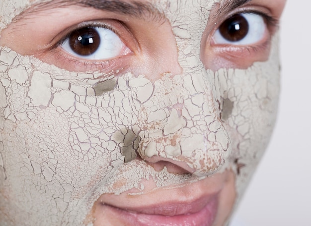 Free Photo woman with face mask looking at the camera extreme close-up