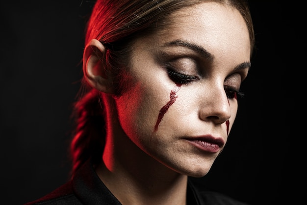 Free Photo woman with fake blood make-up