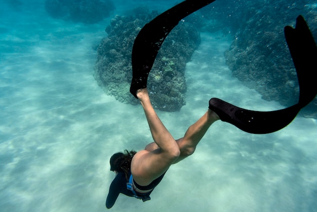 Free Photo woman with flippers swimming in the ocean