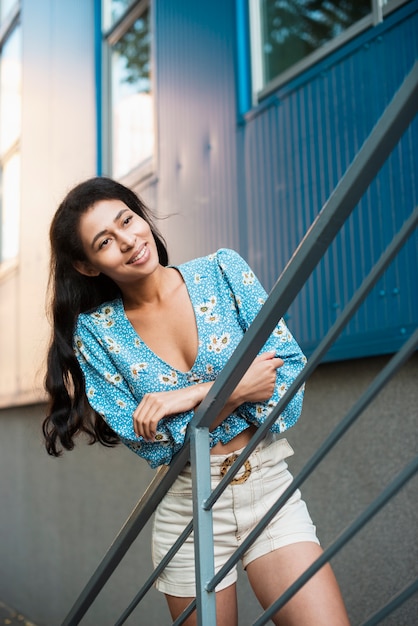 Free photo woman with floral shirt looking away