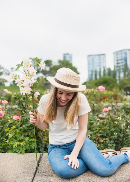 Free photo woman with flowers bouquet laughing