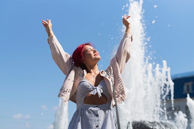 Woman with fountain in background