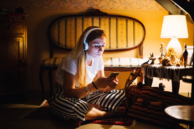 Free Photo woman with gadgets at home