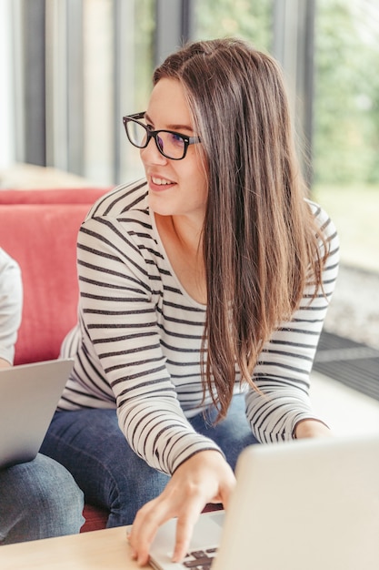 Woman with glasses and laptop