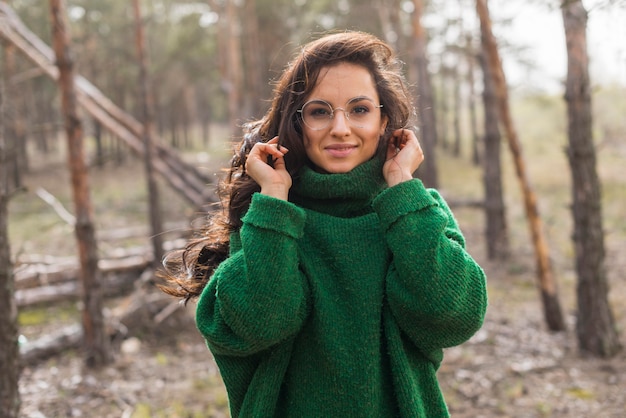 Free photo woman with glasses in nature