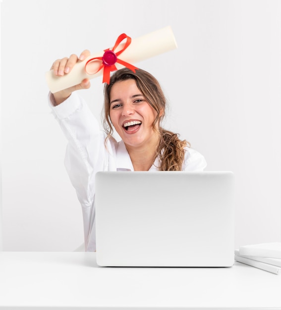 Woman with graduation diploma