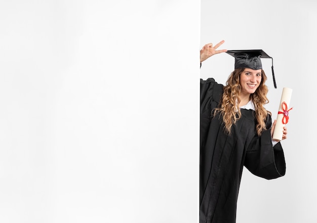 Free Photo woman with graduation diploma