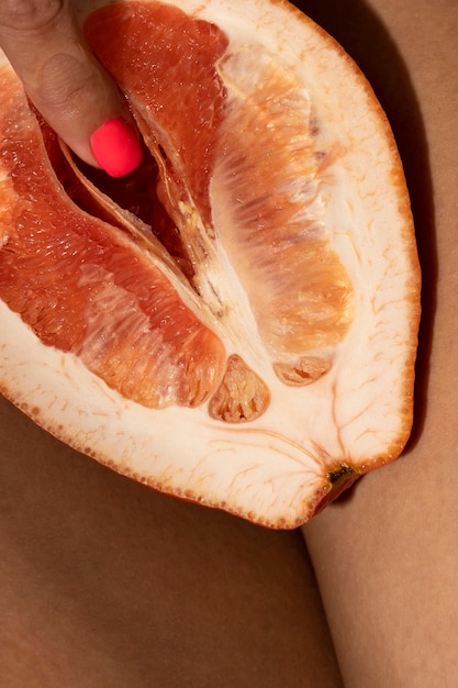 Woman with grapefruit flat lay